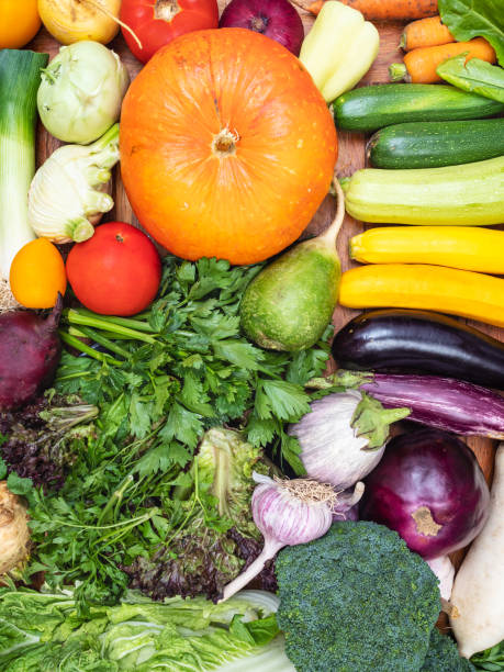 istock top view of many fresh vegetables on wooden table 1168994483