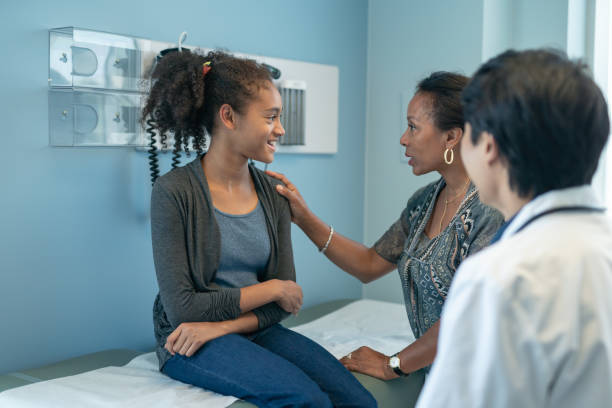 istock Elementary age girl in doctor's appointment 1168997471