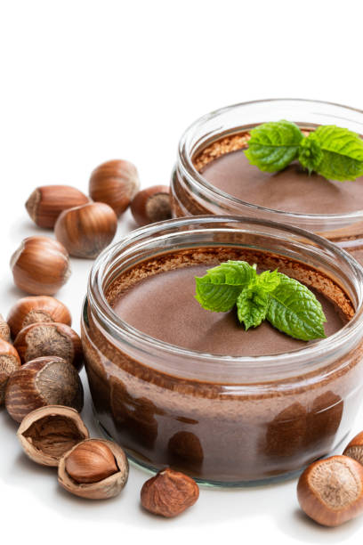 istock Homemade chocolate hazelnut praline in glass jar isolated on white 1168998082