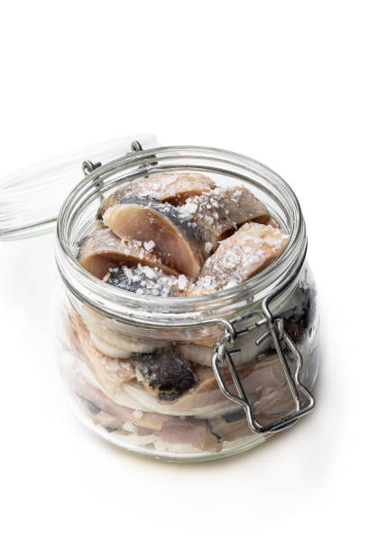 istock Sliced salted herring in glass jar isolated on white 1168998215