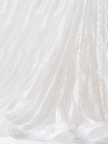 istock Bride laced dress with embroidered elements. Bridal traditional symbolic accessory for wedding ceremony. 1168998216