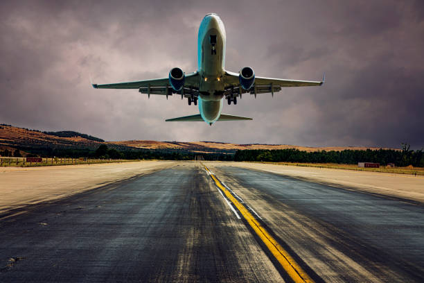 istock Airplane taking off or landing at dusk. 1168999748