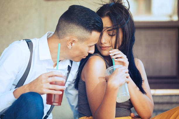 istock Young couple drinking cocktails 1169001040
