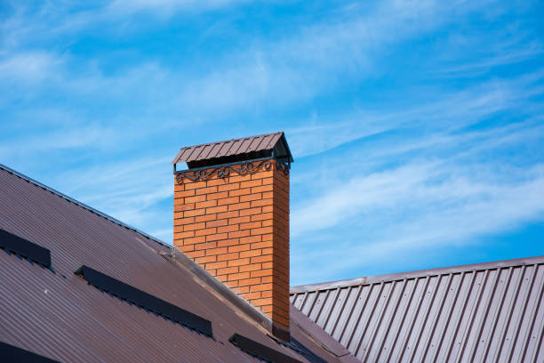 istock Brick chimney with beautiful forging and snow guards on the rooftop 1169001777
