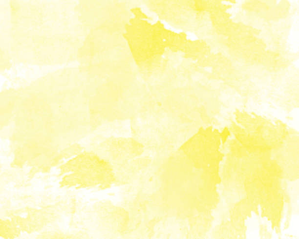 istock Bright yellow watercolor abstraction on white paper 1169003306