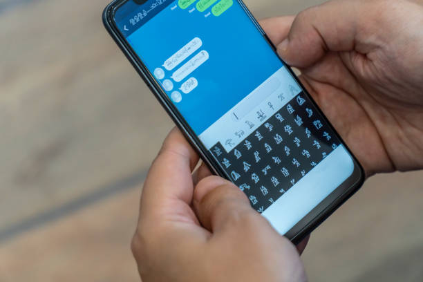 istock Writing alien messages with hieroglyphs on a smartphone 1169003929