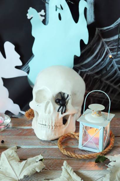 istock Skull, mystical decor, illumination, decorative lantern, autumn leaves 1169004874