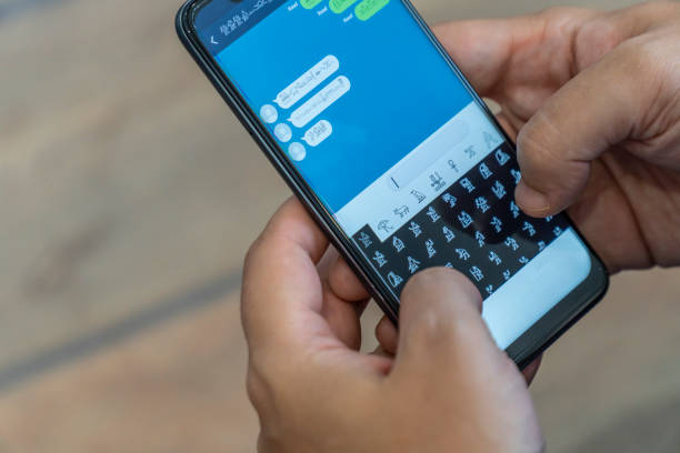 istock Writing alien messages with hieroglyphs on a smartphone 1169005424
