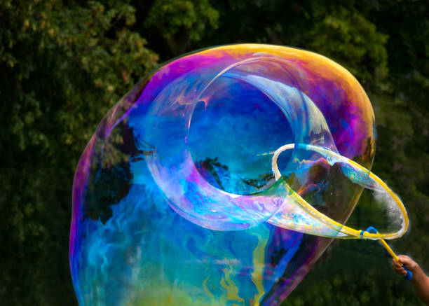 making giant soap bubbles flying, children playing