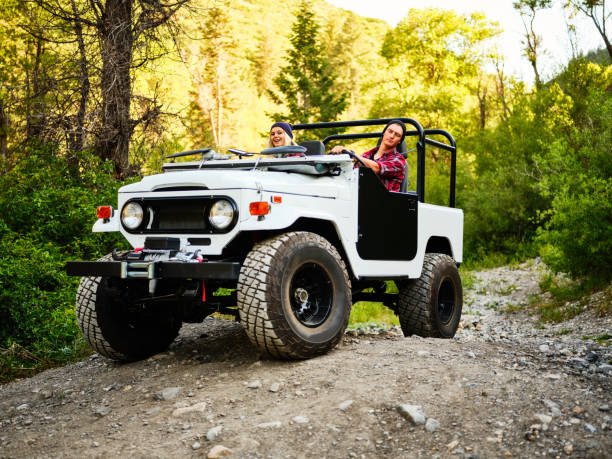 istock Young Couple Driving an Off Road 4x4 1169013754