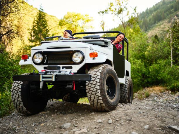 istock Young Couple Driving an Off Road 4x4 1169015144