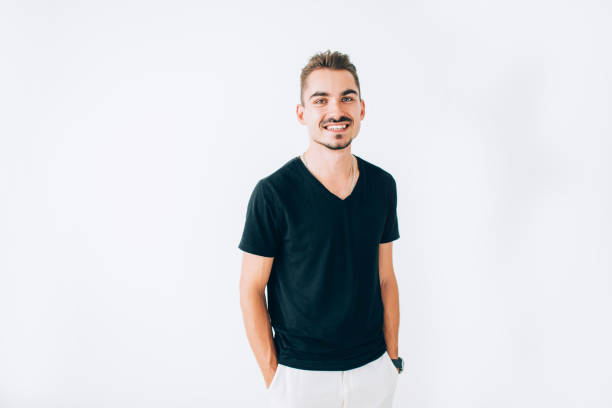 istock Happy young guy standing and smiling on white isolated background. 1169015491