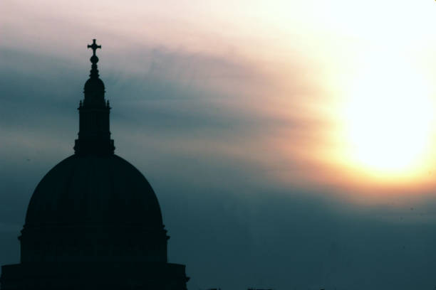 The famous dome of St Paul’s Cathedral on a bright day in winter time. St Paul’s was designed by Sir Christopher Wren and was constructed between 1675 and 1710, combining Gothic, Baroque and Neo-Classical elements. It replaced the former cathedral which had been destroyed during the Great Fire of London in 1666.