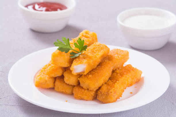 Fried fish sticks ( fingers ) or chicken nuggets . Snack food