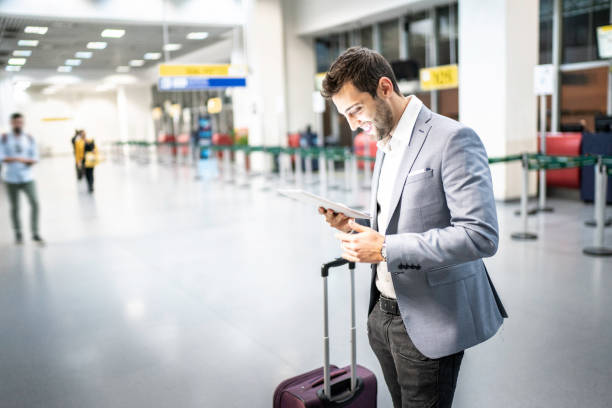 istock Businessman using tablet at airport 1169022533