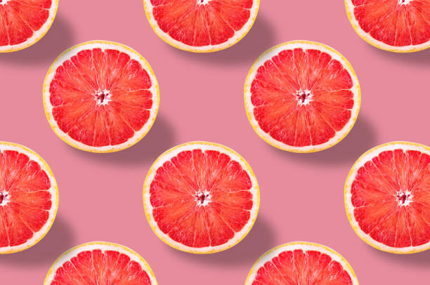 istock Vivid fruit pattern of fresh grapefruit on colourful background 1169023915