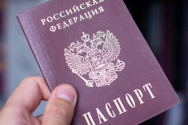 istock Russian passport in hand 1169033060