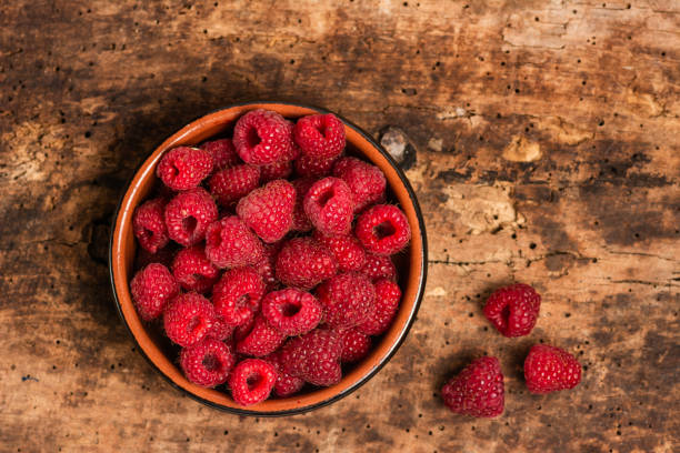 istock Bunch of fresh raspberries in a bowl 1169033069