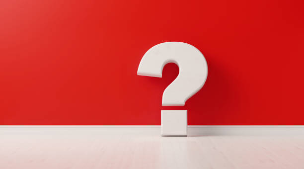 istock Question Mark In Front Of Red Wall - Confusion and Uncertainty Concept 1169034829