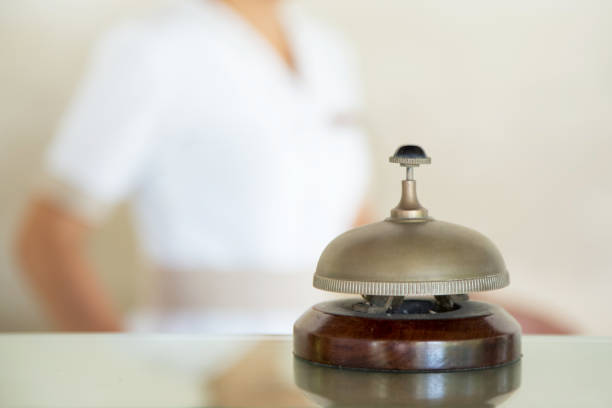 istock Hotel reception service desk bell, Hospitality industry concept 1169034885
