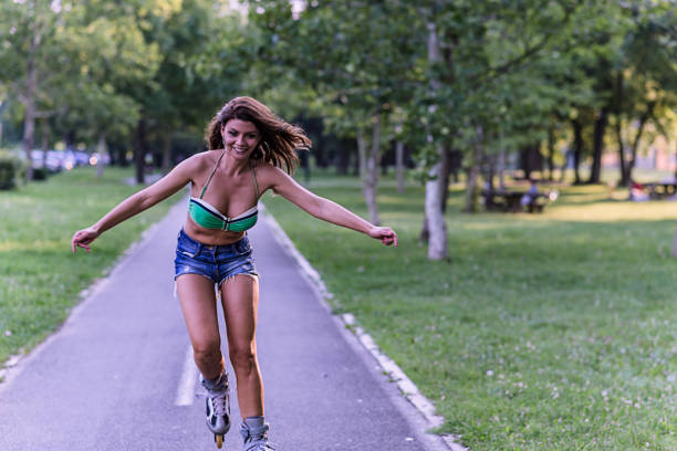istock Woman is Having a Fun in Park on Roller Skates 1169039016