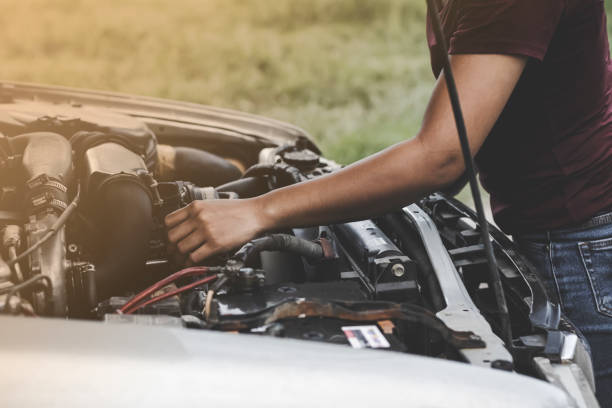 istock The girl who is checking the car engine 1169039722