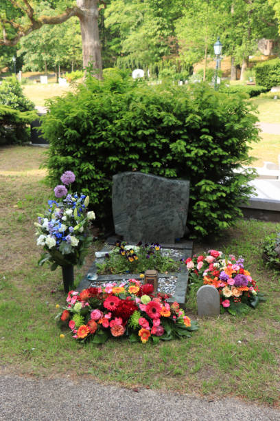 istock Funeral flowers on a marble tomb 1169041137
