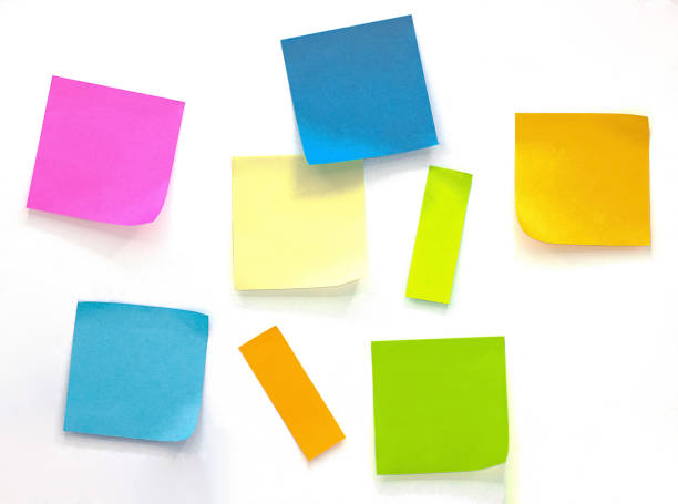 istock Collection of different colored sheets of note papers Isolated on white background 1169043588