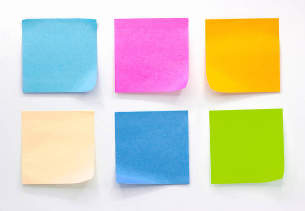 istock Collection of different colored sheets of note papers Isolated on white background 1169043593