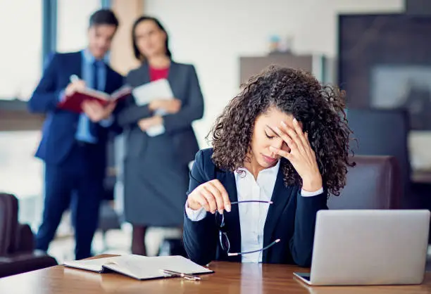 Photo of Burnout businesswoman under pressure in the office