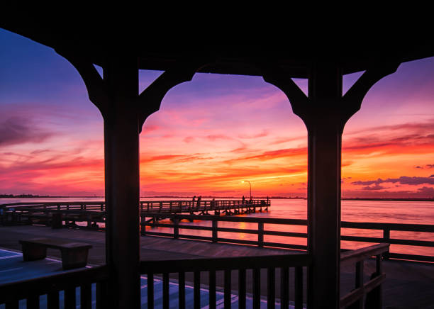 istock Watching the sunset under the gazebo 1169049731