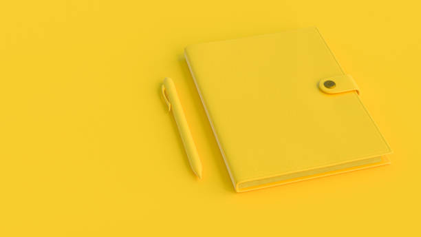 istock Yellow Notebook and pen. Minimal idea concept. 1169053144