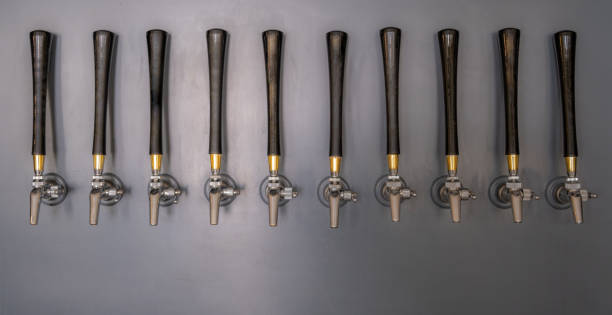 istock 10 Beer Taps Mounted To A Gray Wall 1169057545