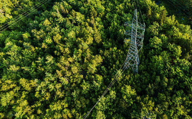 Aerial Drone View: Power Pylon Aerial view of a high voltage power pylon. high voltage sign stock pictures, royalty-free photos & images