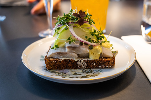 Pickled herring on rye bread with a beer and schnapps.