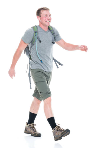 istock Friendly male hiker is happy and walking 1169060644