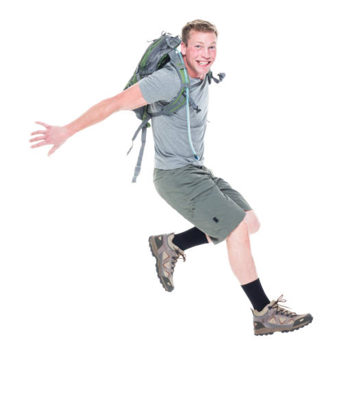 istock Friendly male hiker is jumping with excitement, side view 1169060666