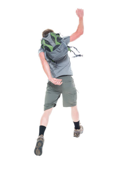 istock Friendly male hiker is jumping with excitement, rear view 1169061234
