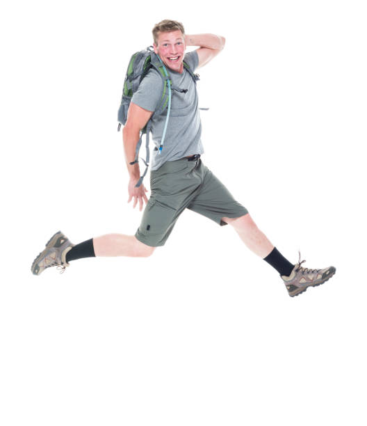istock Friendly male hiker is jumping with excitement 1169061358