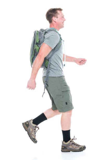 istock Friendly male hiker is happy and walking, sideways 1169061393