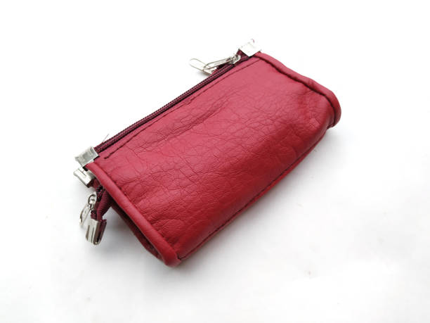 istock pink woman hand purse 1169064746
