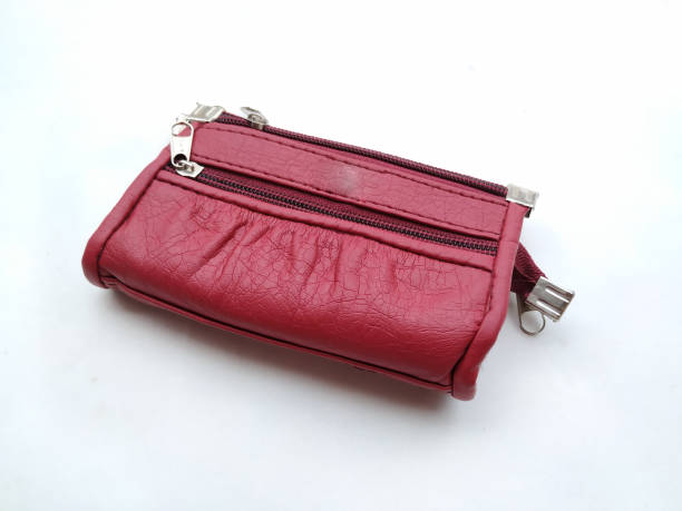 istock pink woman hand purse 1169064747
