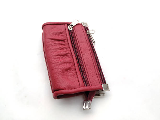 istock pink woman hand purse 1169064775