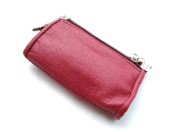 istock pink woman hand purse 1169064893