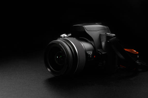 istock Professional digital slr camera on black background 1169065808