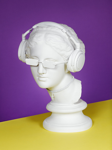 Plaster head model (mass produced replica of Head of Aphrodite of Knidos) with headphones, sunglasses, choker and piercing