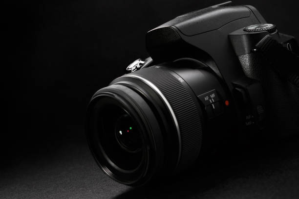 istock Professional digital slr camera on black background 1169066057