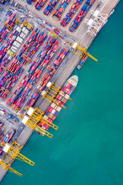 istock Top view of Deep water port with cargo ship and containers. It is an import and export cargo port where is a part of shipping dock and export products worldwide 1169071733