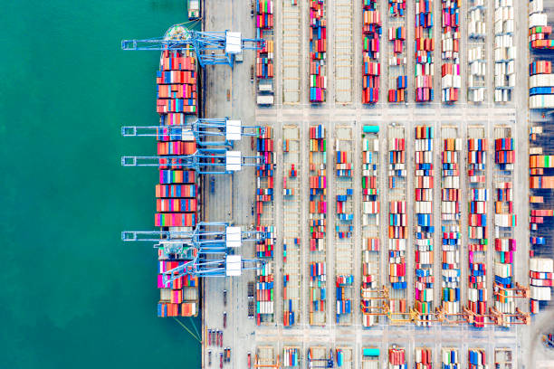 istock Top view of Deep water port with cargo ship and containers. It is an import and export cargo port where is a part of shipping dock and export products worldwide 1169071734