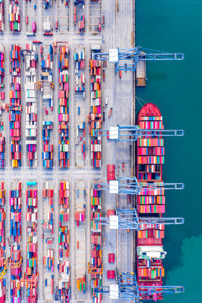 istock Top view of Deep water port with cargo ship and containers. It is an import and export cargo port where is a part of shipping dock and export products worldwide 1169071736
